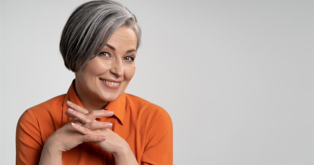 I stopped trying to look younger at 58 and started dressing like a woman who’s earned her age, and the shift in how people treat me has been remarkable