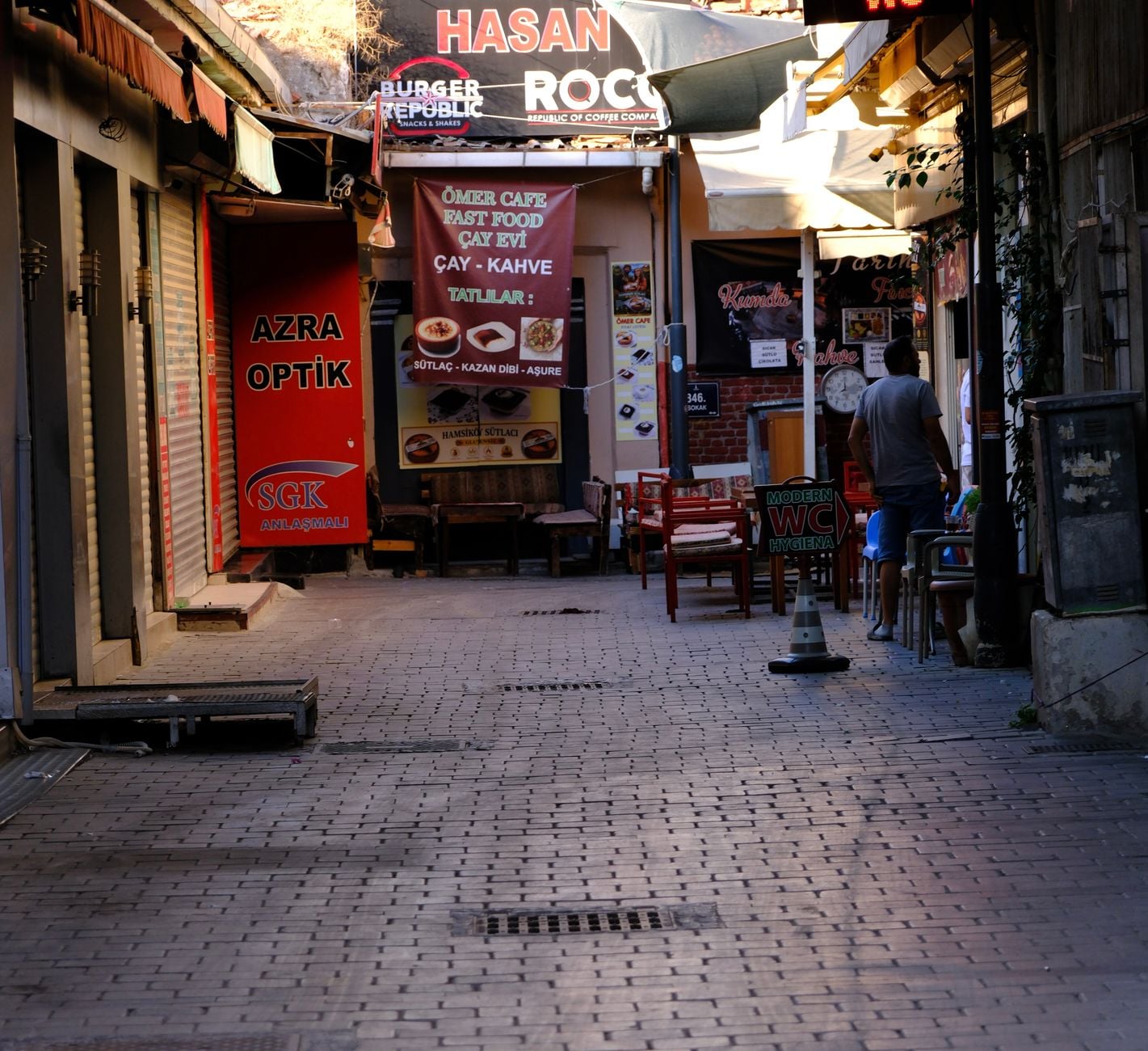 A charming alleyway with cafes and shops in İzmir, perfect for a casual stroll.