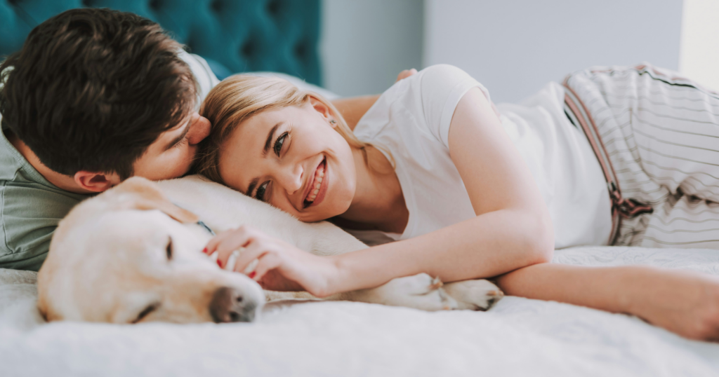 People who sleep beside a pet are often choosing the one form of closeness that comes with no negotiation attached